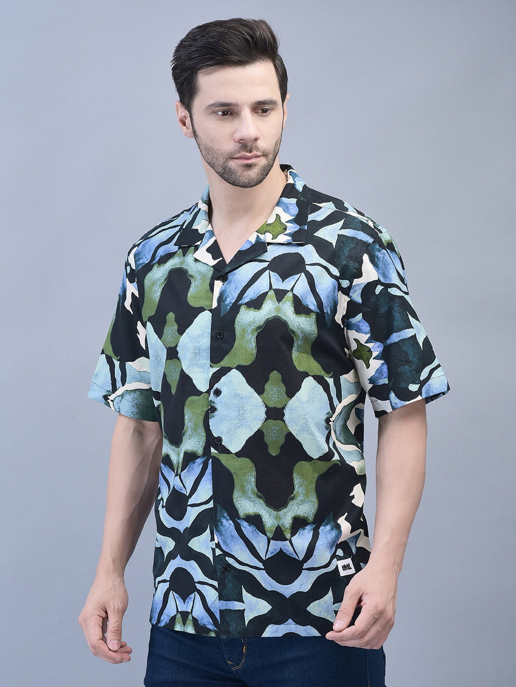 Relaxed front pose of man wearing printed cotton shirt – short sleeve oversized fit