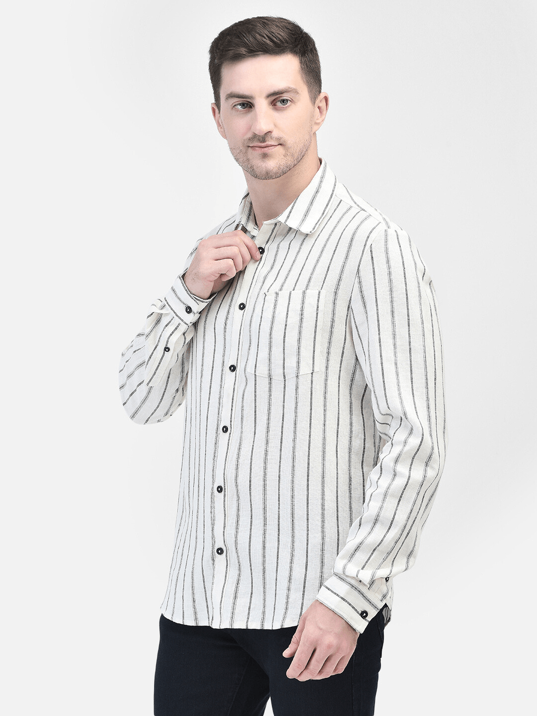 Model wearing a white creme long-sleeve shirt with black vertical stripes, styled with black jeans. Men's White Creme Shirt with Black Stripes | Classic Long-Sleeve Style
Elevate your wardrobe with this classic white cream shirt featuring black vertical stripes. Perfect for both casual and formal occasions, this long-sleeve shirt offers a timeless look.
Keywords: men's white cream shirt, black stripe shirt, long-sleeve shirt, vertical stripes, classic men's fashion, formal casual wear. white striped shirt