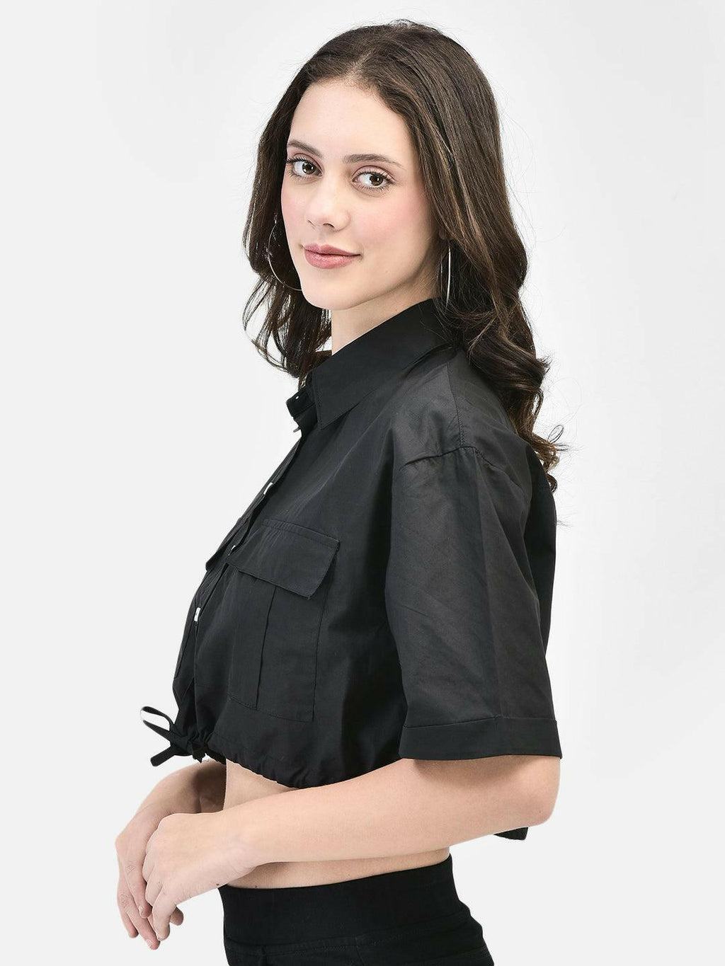 Side profile of black short-sleeve shirt with front knot detailing