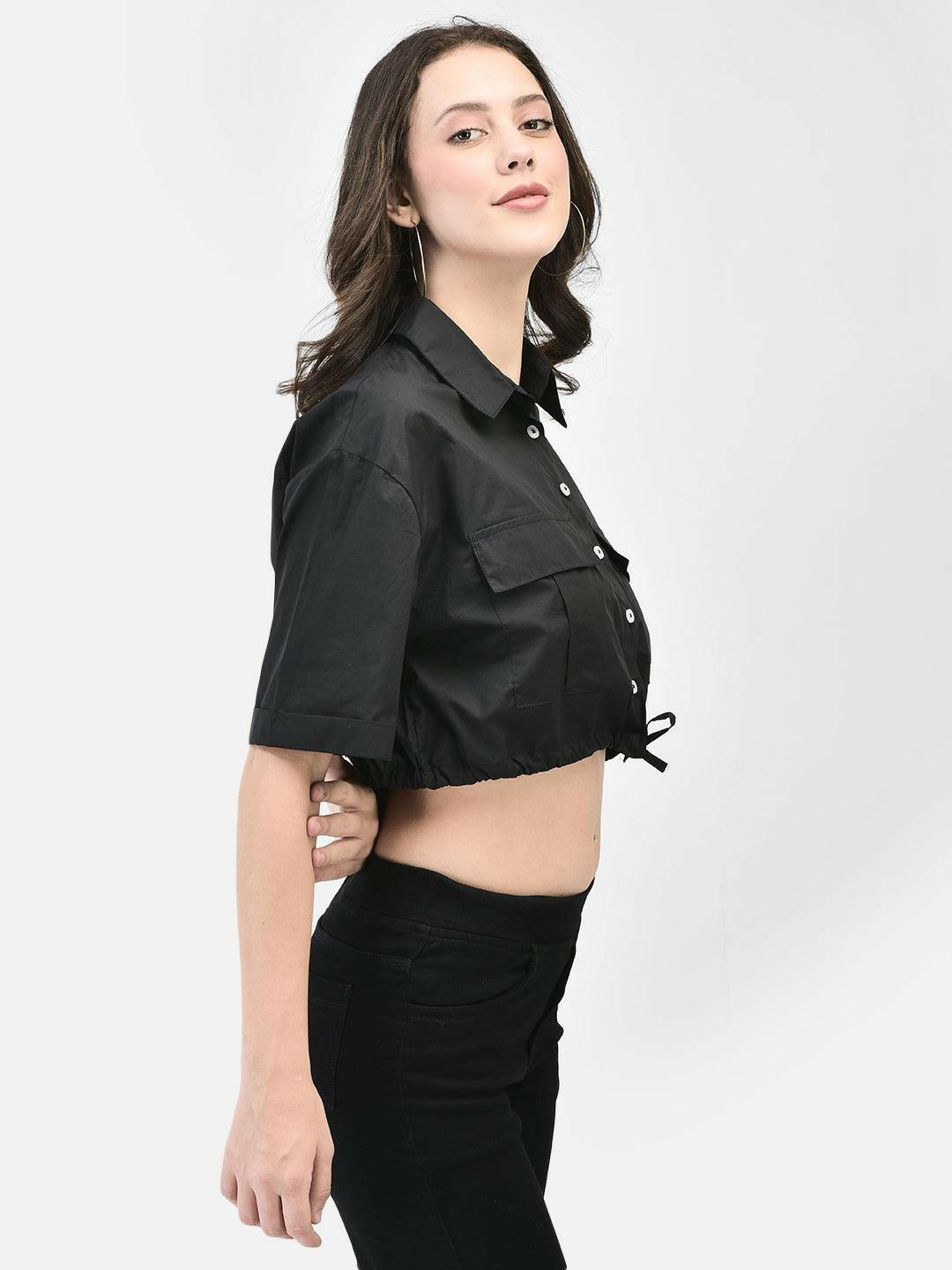 Alt Text: Woman wearing a black cropped shirt with drawstrings elvtd. Meta Tags and Keywords: - Meta Tags: Women's Cropped Shirt, Midriff Shirt, Drawstring Top, Black Shirt, elvtd. Fashion - Keywords: women's cropped shirt, midriff shirt, drawstring shirt, black top, stylish women's clothing, elvtd. fashion, trendy women's outfit, casual wear, fashion essentials, summer fashion