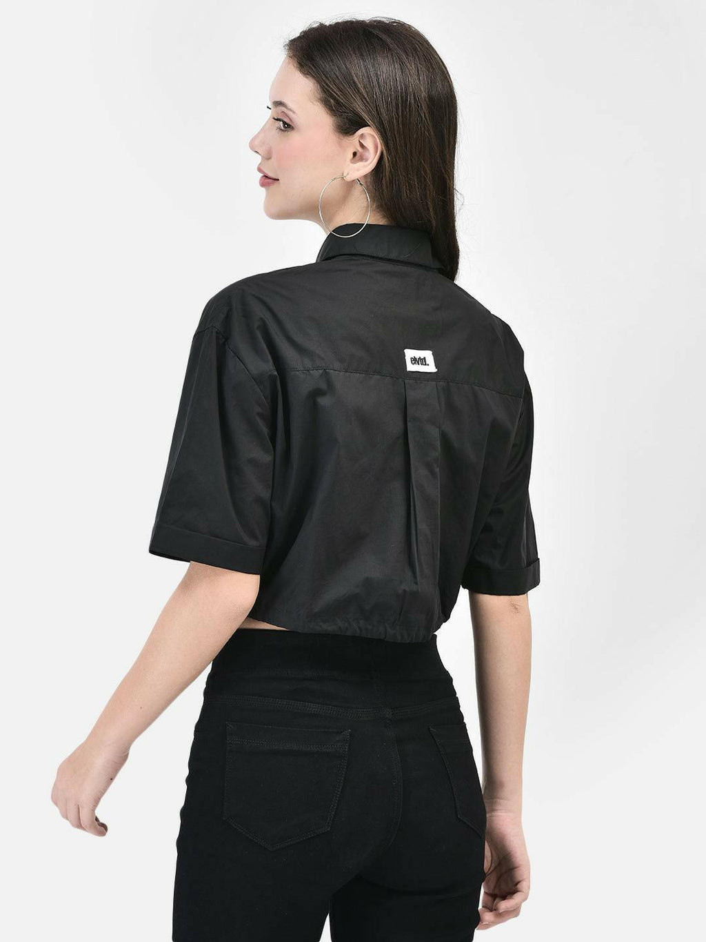Back view of black cotton crop shirt featuring small logo patch
