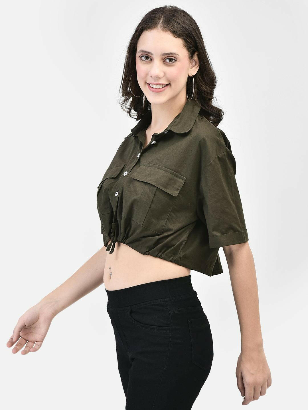 Model wearing a olive colored cropped shirt with front pockets, paired with black high-waisted pants and black heels.
Meta Tags:
Olive Cropped Shirt with Front Pockets | elvtd. Fashion
Elevate your casual look with this Olive Moss cropped shirt featuring front pockets and a stylish tie-front. Perfect for pairing with high-waisted pants for a chic and modern outfit.
Keywords: Olive moss cropped shirt, front pocket shirt, women's casual shirt, tie-front shirt, olive fashion top 