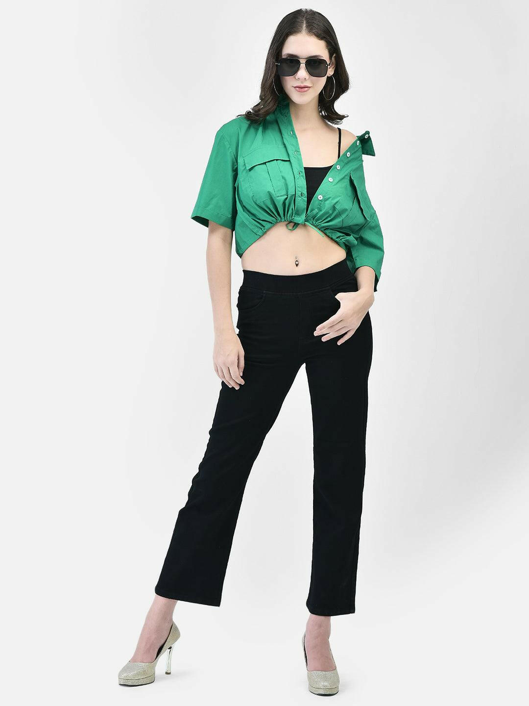 Model wearing a green cropped shirt with front pockets, paired with black high-waisted pants and beige heels.
Meta Tags:
Green Cropped Shirt with Front Pockets | elvtd. Fashion
Elevate your casual look with this green cropped shirt featuring front pockets and a stylish tie-front. Perfect for pairing with high-waisted pants for a chic and modern outfit.
Keywords: Green cropped shirt, front pocket shirt, women's casual shirt, tie-front shirt, green fashion top