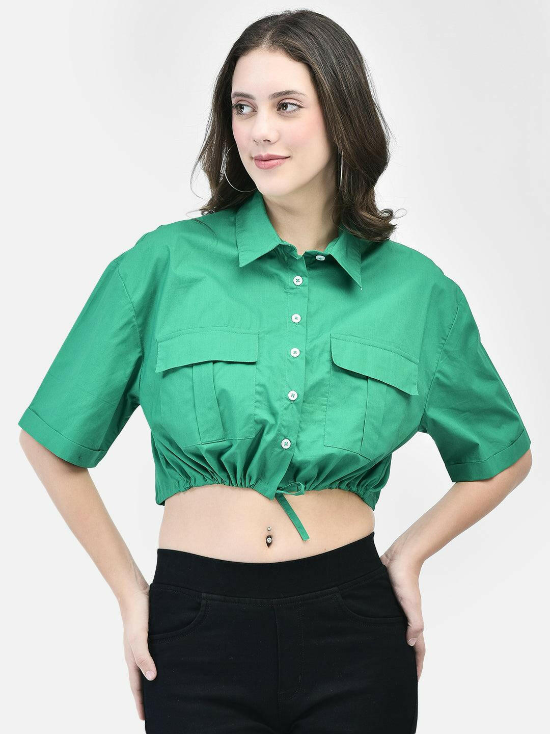 Model wearing a green cropped shirt with front pockets, paired with black high-waisted pants and beige heels.
Meta Tags:
Green Cropped Shirt with Front Pockets | elvtd. Fashion
Elevate your casual look with this green cropped shirt featuring front pockets and a stylish tie-front. Perfect for pairing with high-waisted pants for a chic and modern outfit.
Keywords: Green cropped shirt, front pocket shirt, women's casual shirt, tie-front shirt, green fashion top