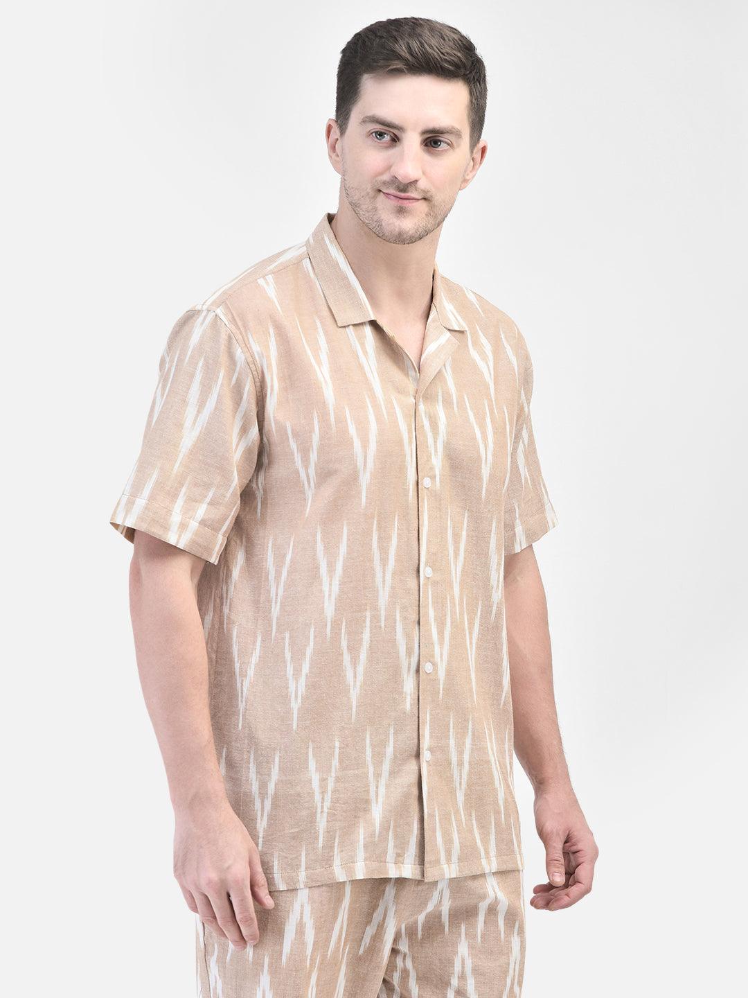 Alt Text: Man wearing beige and white patterned co-ord set with matching shirt and shorts by elvtd. Meta Tags and Keywords: - Meta Tags: Men's Co-ord Set, Summer Outfit, Casual Wear, Beachwear, elvtd. Fashion - Keywords: men's co-ord set, beige and white patterned outfit, matching shirt and shorts, summer fashion, casual summer outfit, elvtd. men's wear, stylish men's outfit, beachwear, summer wardrobe essentials