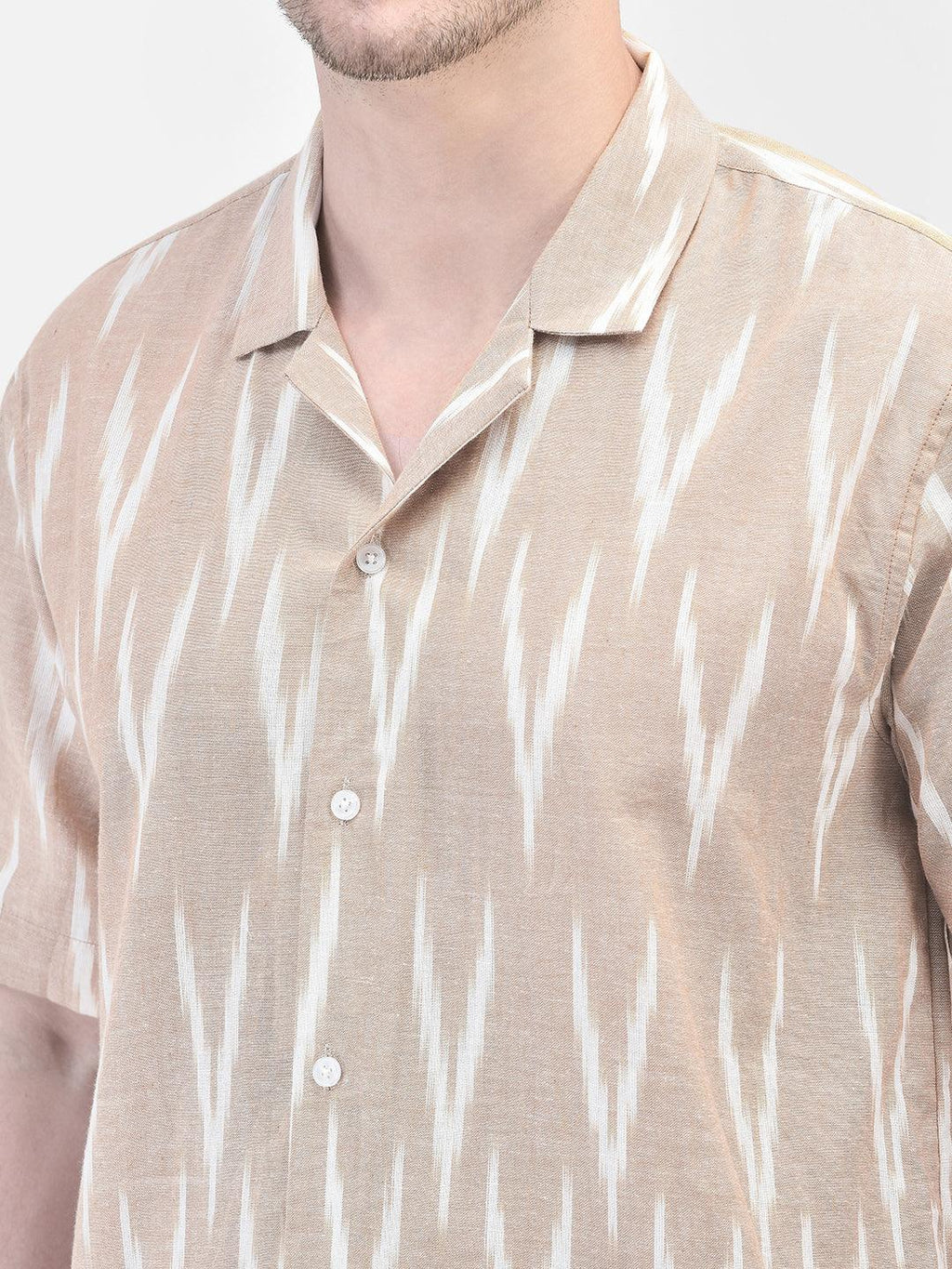 Alt Text: Man wearing beige and white patterned co-ord set with matching shirt and shorts by elvtd. Meta Tags and Keywords: - Meta Tags: Men's Co-ord Set, Summer Outfit, Casual Wear, Beachwear, elvtd. Fashion - Keywords: men's co-ord set, beige and white patterned outfit, matching shirt and shorts, summer fashion, casual summer outfit, elvtd. men's wear, stylish men's outfit, beachwear, summer wardrobe essentials