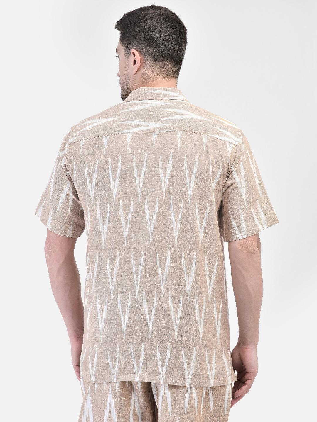 Alt Text: Man wearing beige and white patterned co-ord set with matching shirt and shorts by elvtd. Meta Tags and Keywords: - Meta Tags: Men's Co-ord Set, Summer Outfit, Casual Wear, Beachwear, elvtd. Fashion - Keywords: men's co-ord set, beige and white patterned outfit, matching shirt and shorts, summer fashion, casual summer outfit, elvtd. men's wear, stylish men's outfit, beachwear, summer wardrobe essentials