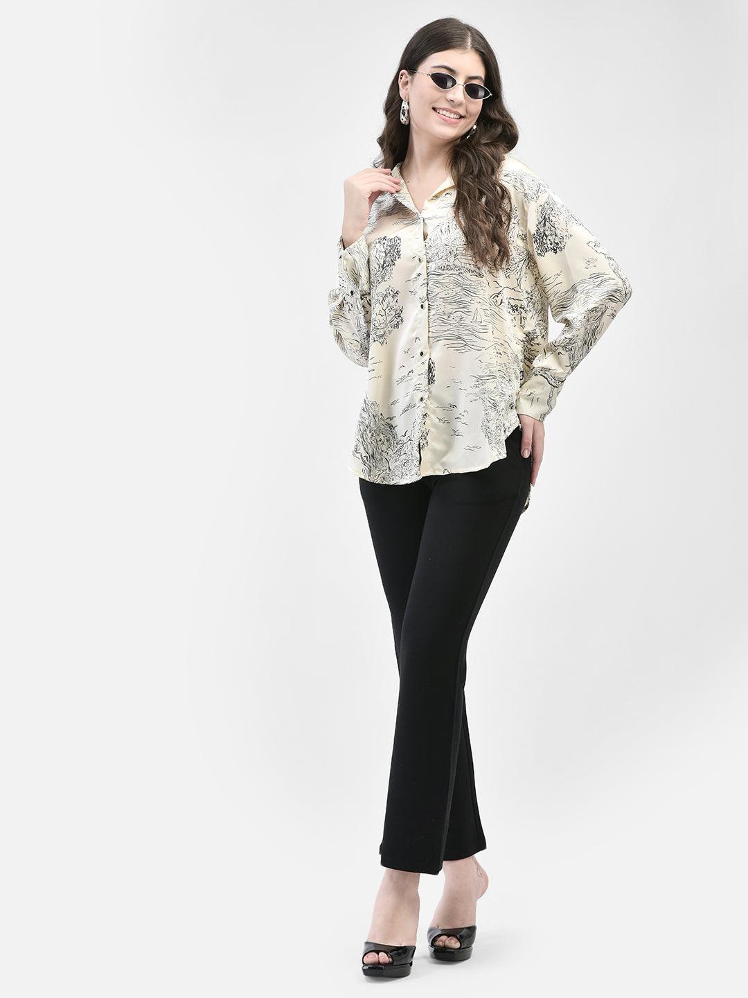 Model wearing an ivory satin blouse with black scenic print and long sleeves, paired with black pants. Elegant Ivory Satin Blouse with Scenic Print | Women's Long Sleeve Top
Discover this luxurious ivory satin blouse featuring a unique black scenic print. Perfect for both casual and formal settings, this long-sleeve top adds a touch of elegance to any outfit.
Ivory satin blouse, scenic print blouse, women's satin top, long sleeve blouse, elegant women's clothing. Ivory satin blouse
scenic print top
women's 